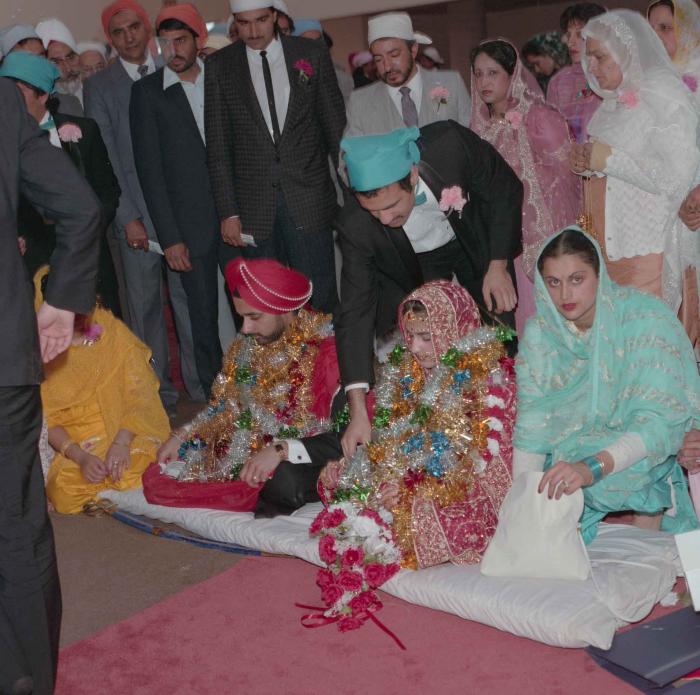 [Photo of Harjinder Gill, Wendy Grewal and the wedding guests]