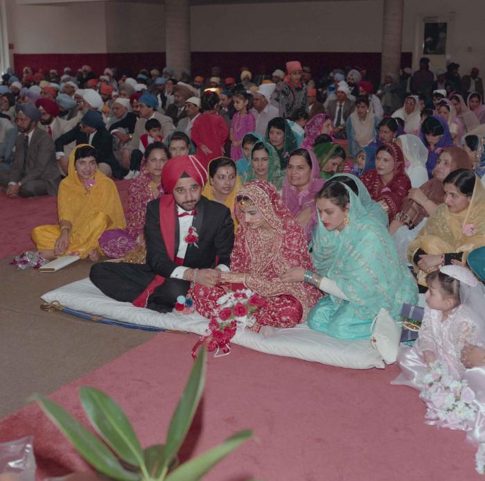 [Photo of Harjinder Gill, Wendy Grewal and the wedding guests]