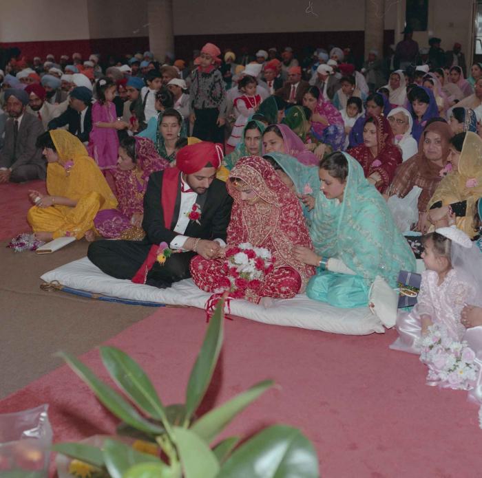 [Photo of Harjinder Gill, Wendy Grewal and the wedding guests]