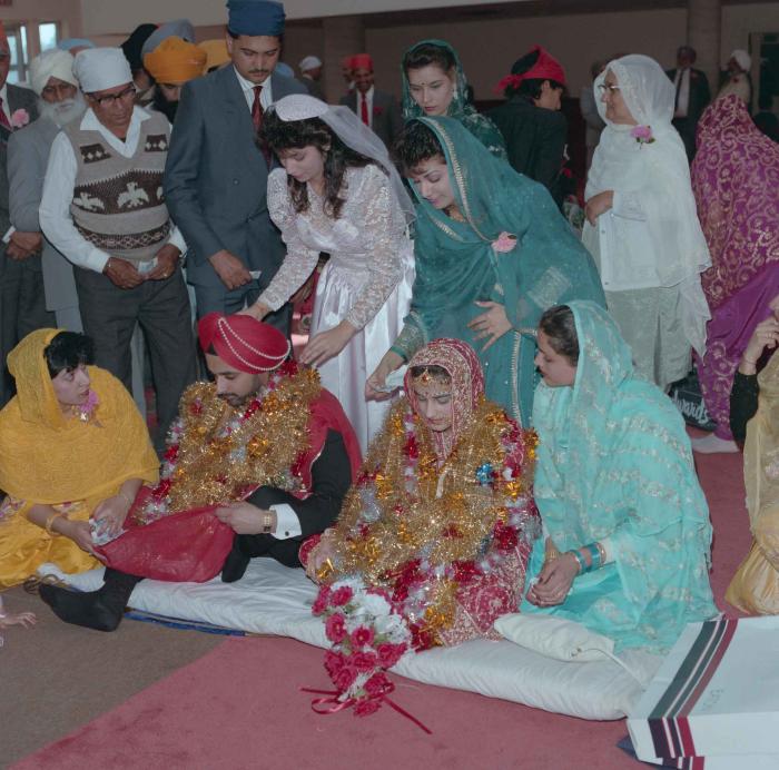 [Photo of Harjinder Gill, Wendy Grewal and the wedding guests]