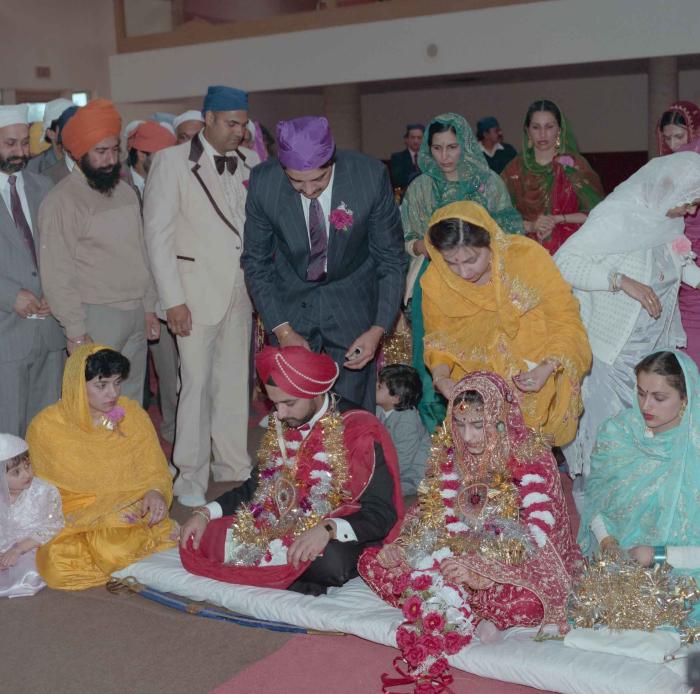 [Photo of Harjinder Gill, Wendy Grewal and the wedding guests]