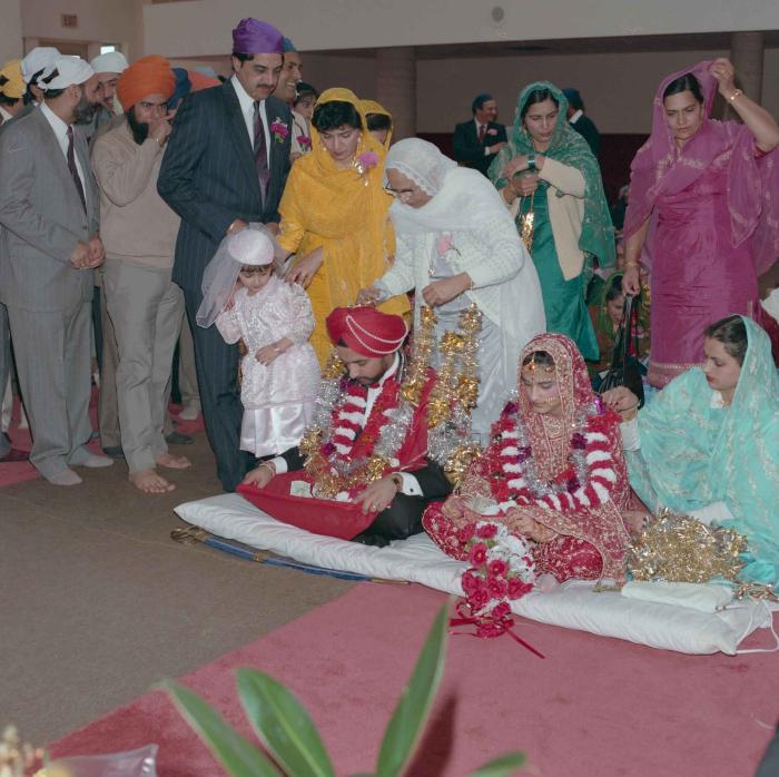 [Photo of Harjinder Gill, Wendy Grewal and the wedding guests]