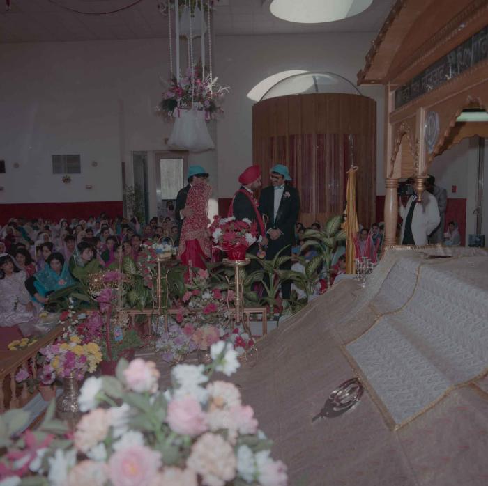 [Photo of Harjinder Gill, Wendy Grewal and the wedding guests]