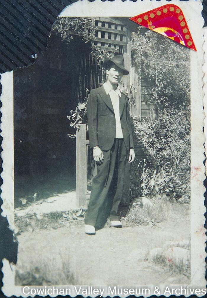 [Unidentified man wearing a fedora and suit]