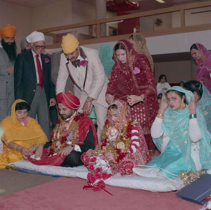 [Photo of Harjinder Gill, Wendy Grewal and the wedding guests]