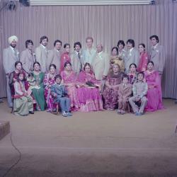 [Group portrait of H.S. Dhaliwal, an unidentified bride and wedding guests]
