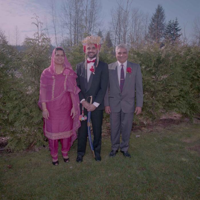 [Photo of Harjinder Gill, an unidentified woman and an unidentified man]