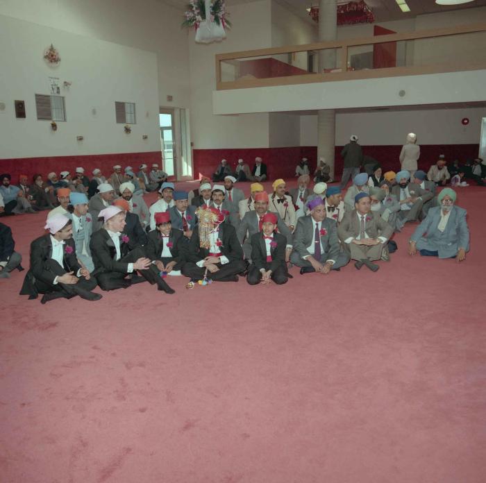 [Photo of Harjinder Gill and wedding guests]