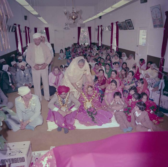 [Photo of David Gill, Kamaljeet Grewal and the wedding guests]