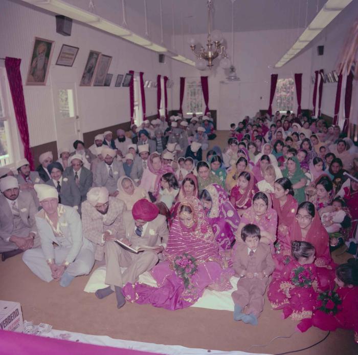 [Photo of David Gill, Kamaljeet Grewal and the wedding guests]