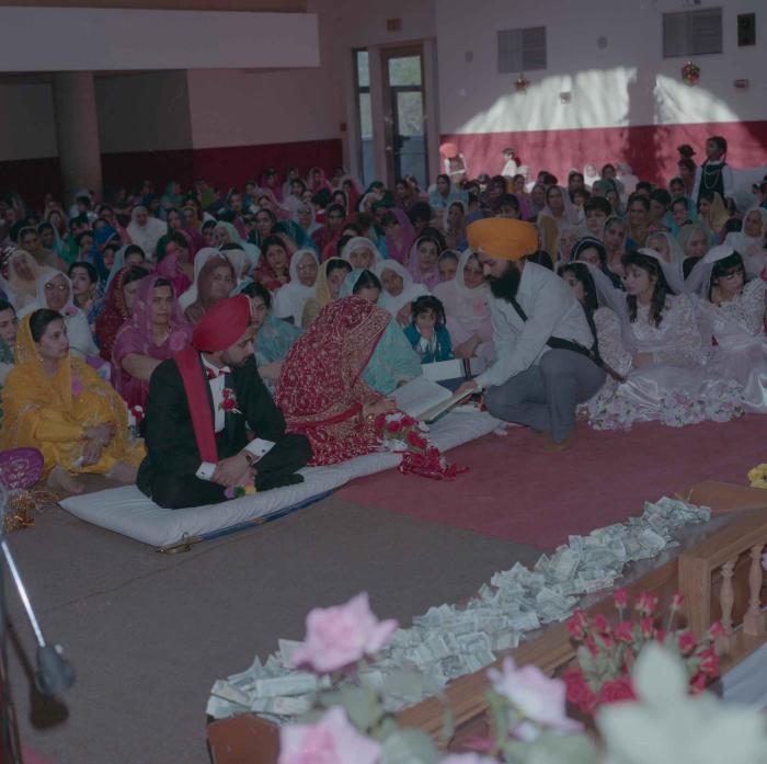 [Photo of Harjinder Gill, Wendy Grewal and the wedding guests]