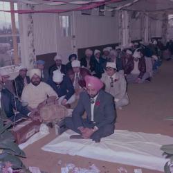 [Photo of Baljinder Gill and the wedding guests]