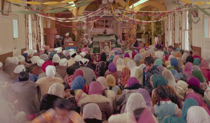 [Photo of the wedding guests in the Gurdwara facing the Granthi]