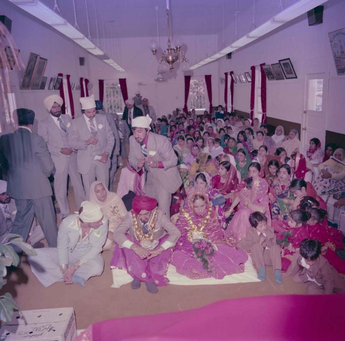 [Photo of David Gill, Kamaljeet Grewal and the wedding guests]