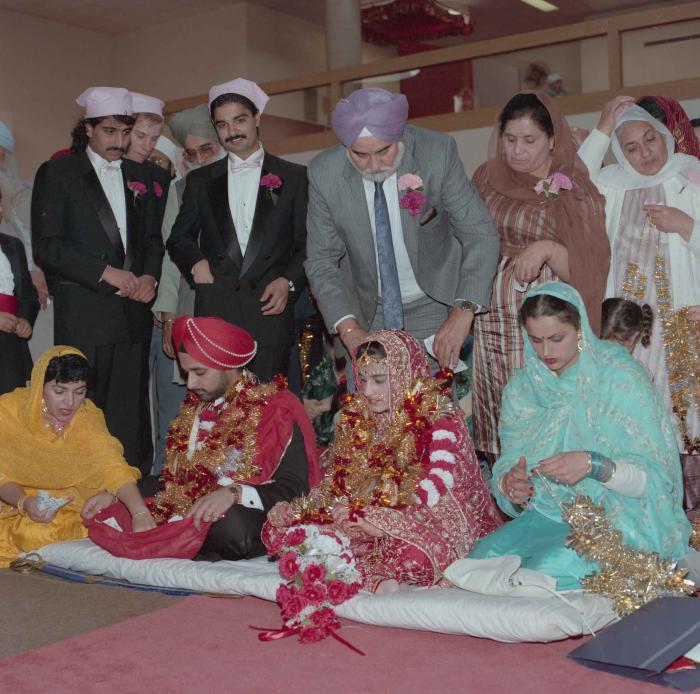 [Photo of Harjinder Gill, Wendy Grewal and the wedding guests]