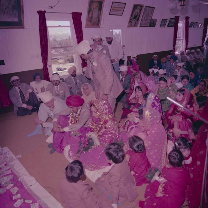 [Photo of David Gill, Kamaljeet Grewal and the wedding guests]