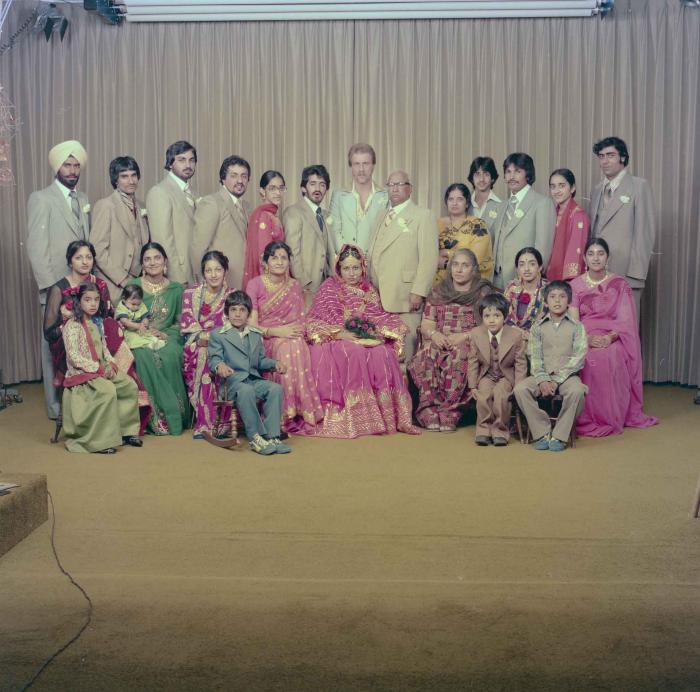 [Group portrait of David Gill, Kamaljeet Grewal and wedding guests]