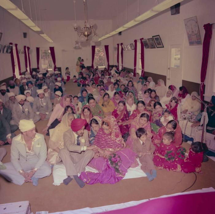 [Photo of David Gill, Kamaljeet Grewal and the wedding guests]