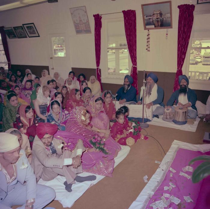 [Photo of David Gill, Kamaljeet Grewal and the wedding guests]