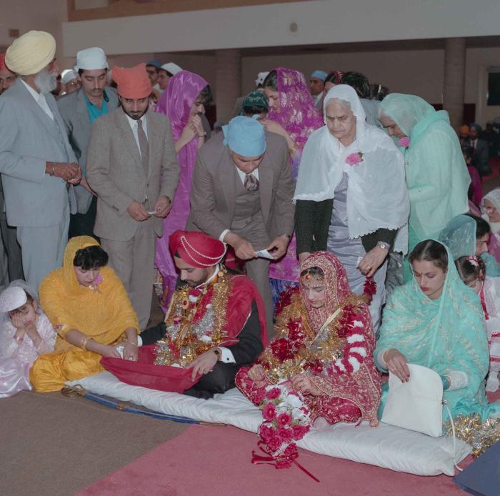 [Photo of Harjinder Gill, Wendy Grewal and the wedding guests]