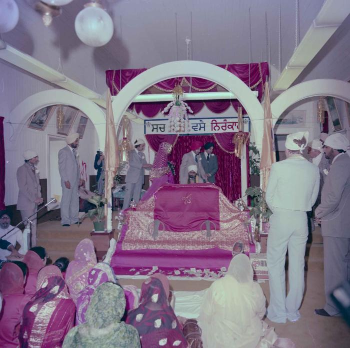 [Photo of David Gill, Kamaljeet Grewal and the wedding guests]