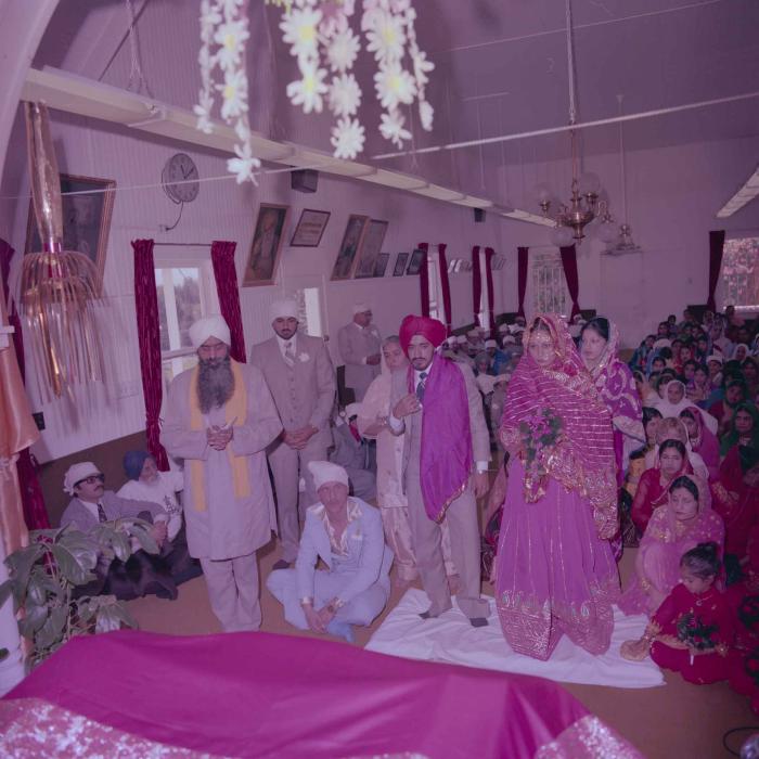 [Photo of David Gill, Kamaljeet Grewal and the wedding guests]
