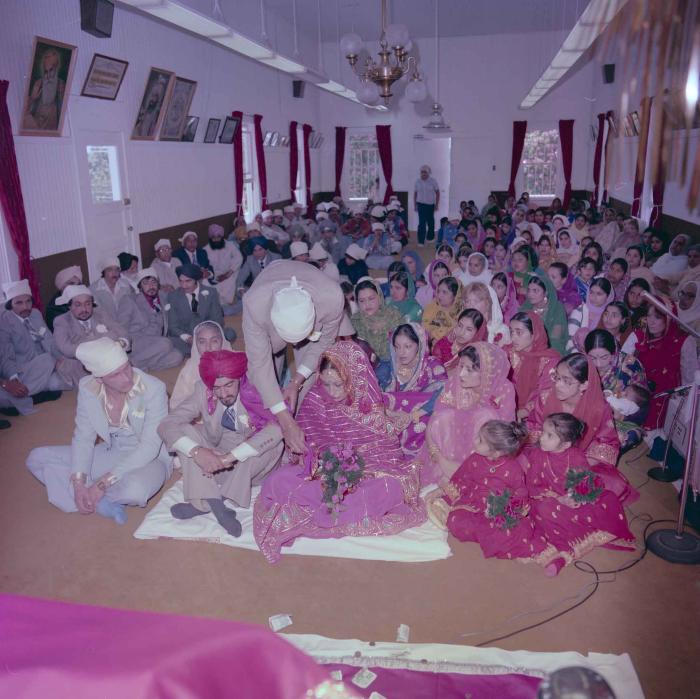 [Photo of David Gill, Kamaljeet Grewal and the wedding guests]