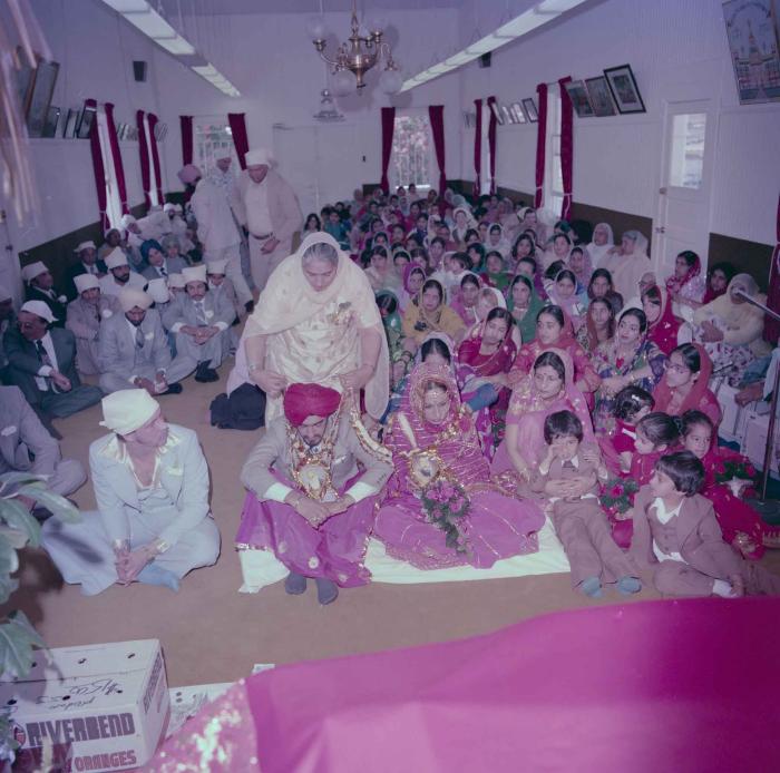 [Photo of David Gill, Kamaljeet Grewal and the wedding guests]