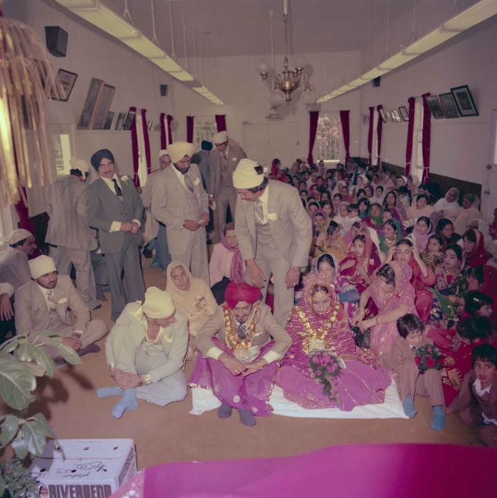 [Photo of David Gill, Kamaljeet Grewal and the wedding guests]