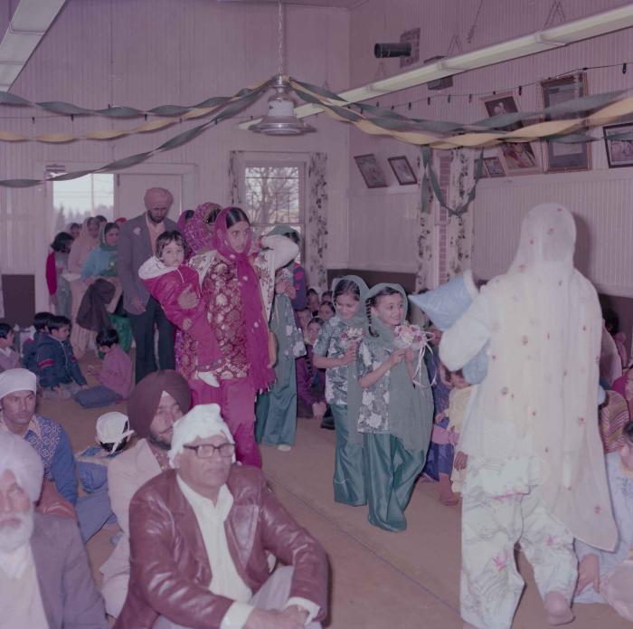 [Photo of Gurcharah Dhaliwal and the wedding guests]
