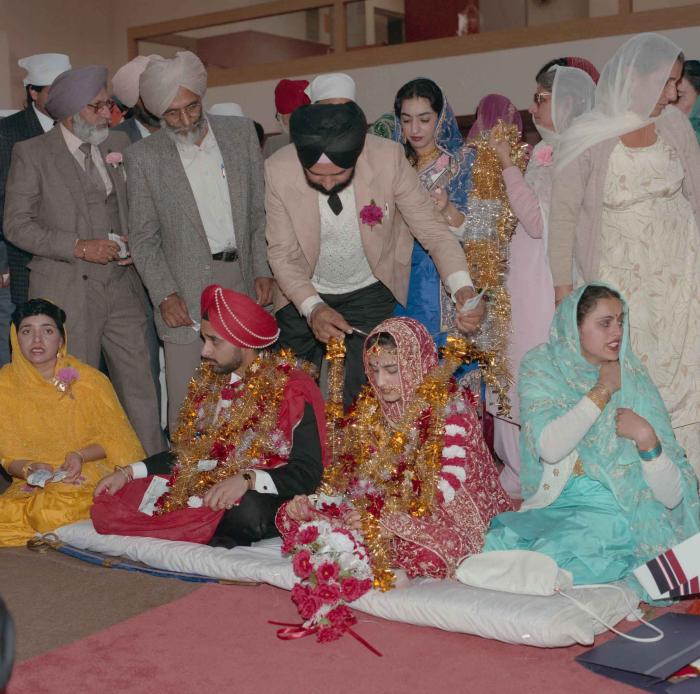 [Photo of Harjinder Gill, Wendy Grewal and the wedding guests]