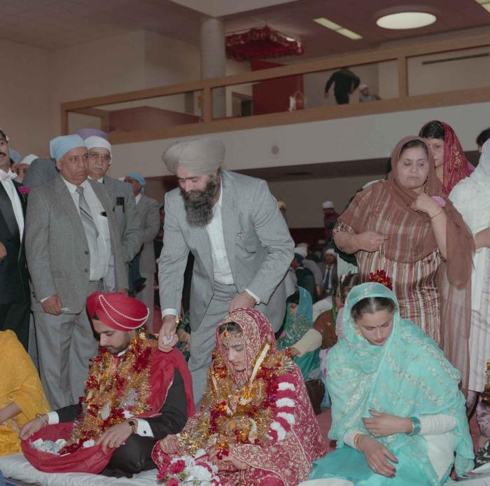 [Photo of Harjinder Gill, Wendy Grewal and the wedding guests]