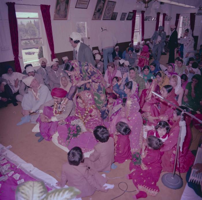 [Photo of David Gill, Kamaljeet Grewal and the wedding guests]