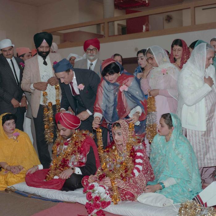 [Photo of Harjinder Gill, Wendy Grewal and the wedding guests]