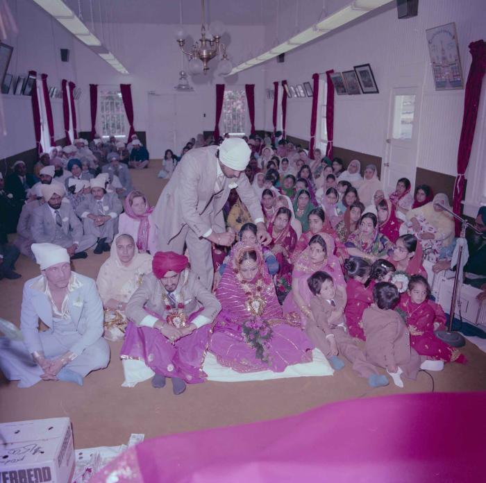 [Photo of David Gill, Kamaljeet Grewal and the wedding guests]