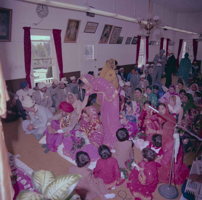 [Photo of David Gill, Kamaljeet Grewal and the wedding guests]