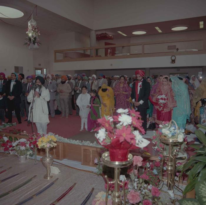 [Photo of Harjinder Gill, Wendy Grewal and the wedding guests]