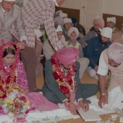 [Photo of Baljinder Gill, Gurcharah Dhaliwal and the wedding guests]