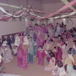 [Photo of Gurcharah Dhaliwal and the wedding guests]