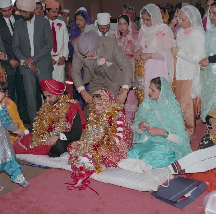 [Photo of Harjinder Gill, Wendy Grewal and the wedding guests]