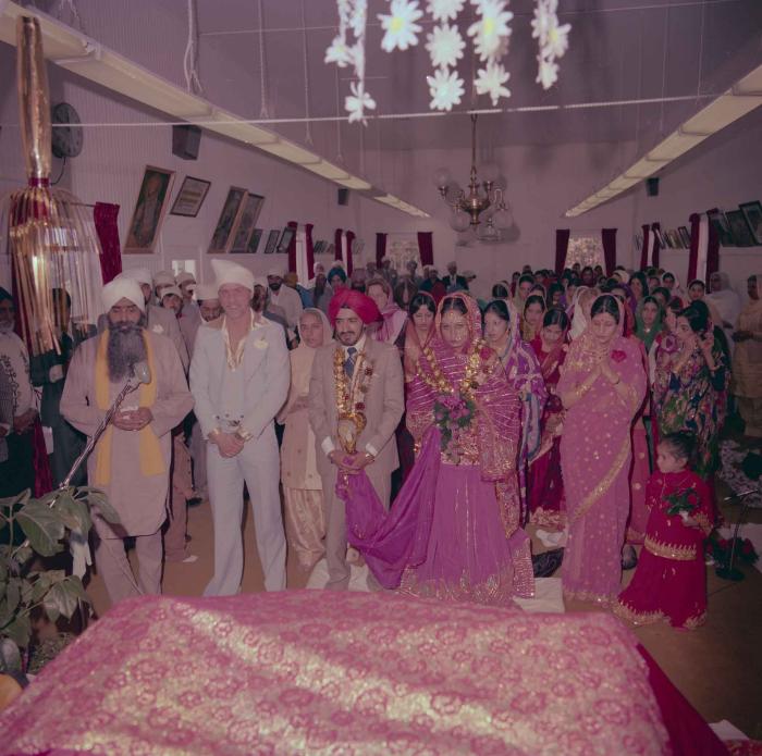 [Photo of David Gill, Kamaljeet Grewal and the wedding guests]