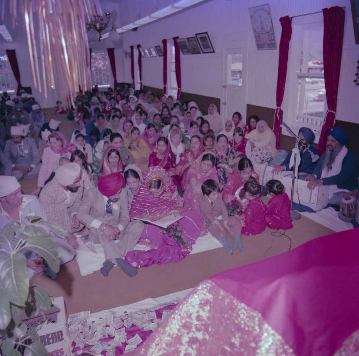 [Photo of David Gill, Kamaljeet Grewal and the wedding guests]