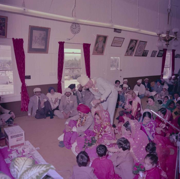 [Photo of David Gill, Kamaljeet Grewal and the wedding guests]