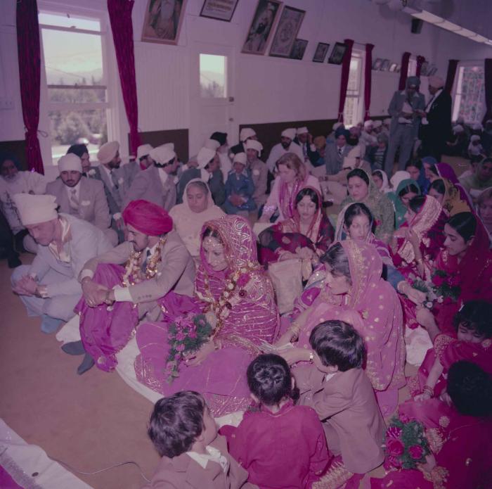 [Photo of David Gill, Kamaljeet Grewal and the wedding guests]
