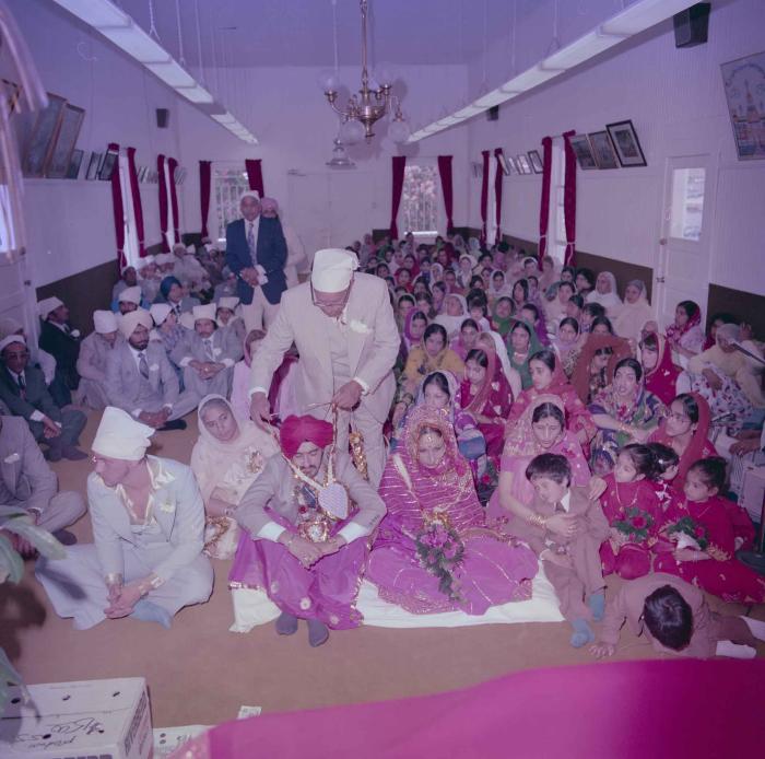 [Photo of David Gill, Kamaljeet Grewal and the wedding guests]