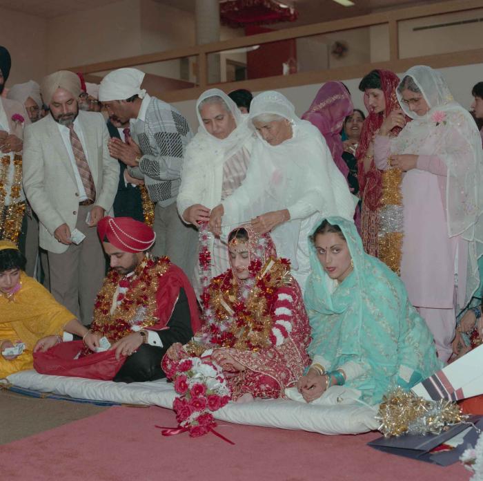 [Photo of Harjinder Gill, Wendy Grewal and the wedding guests]