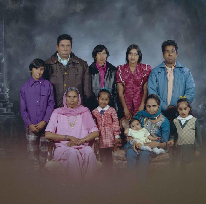 [Group portrait of two unidentified men, two unidentified women and six unidentified children]