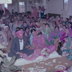 [Group portrait of H.S. Dhaliwal, an unidentified bride and wedding guests]