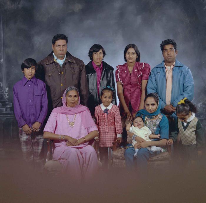 [Group portrait of two unidentified men, two unidentified women and six unidentified children]