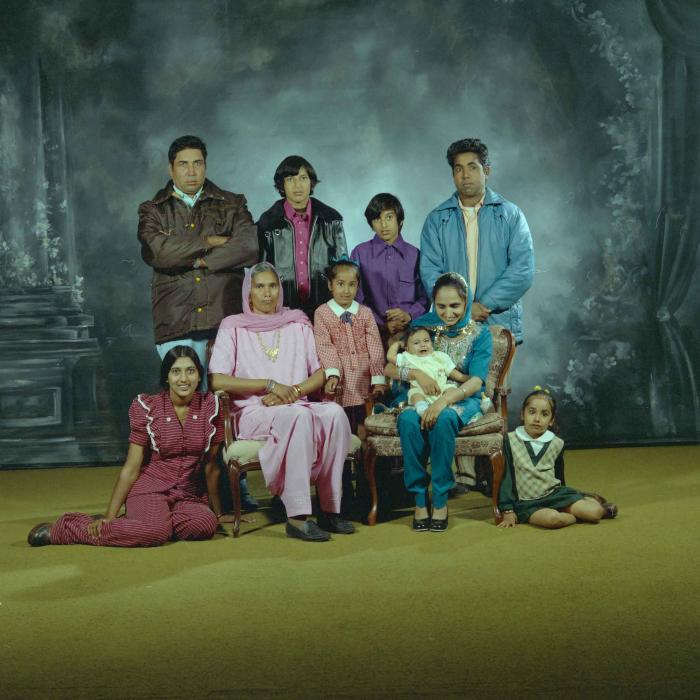 [Group portrait of two unidentified men, two unidentified women and six unidentified children]